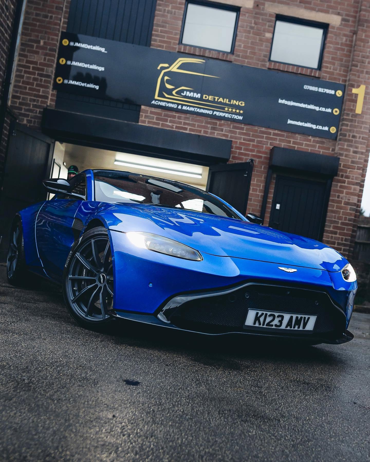 Blue Aston Martin outside the JMM Detailing studio
