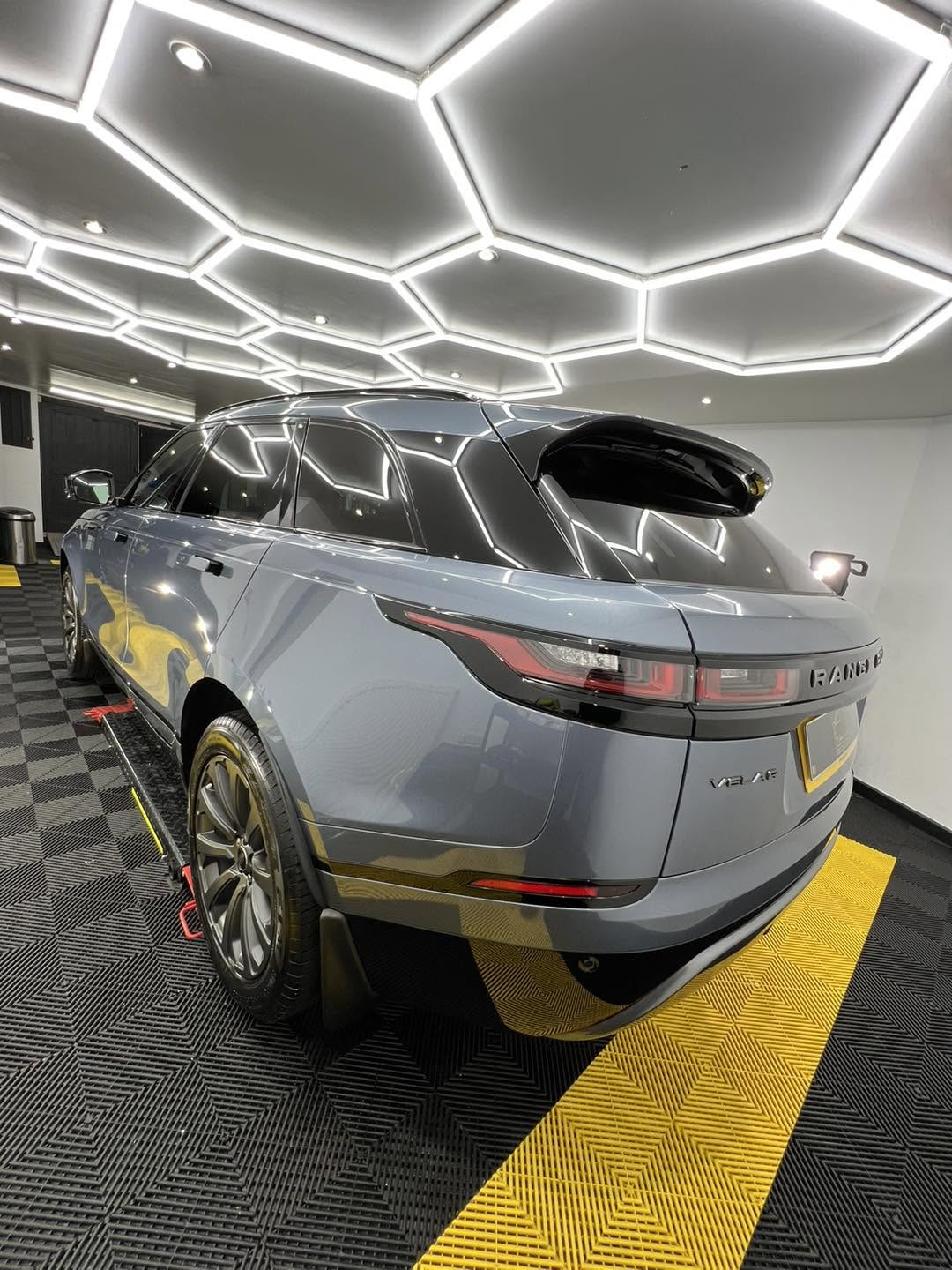 Grey Range Rover with a high-gloss finish in the studio