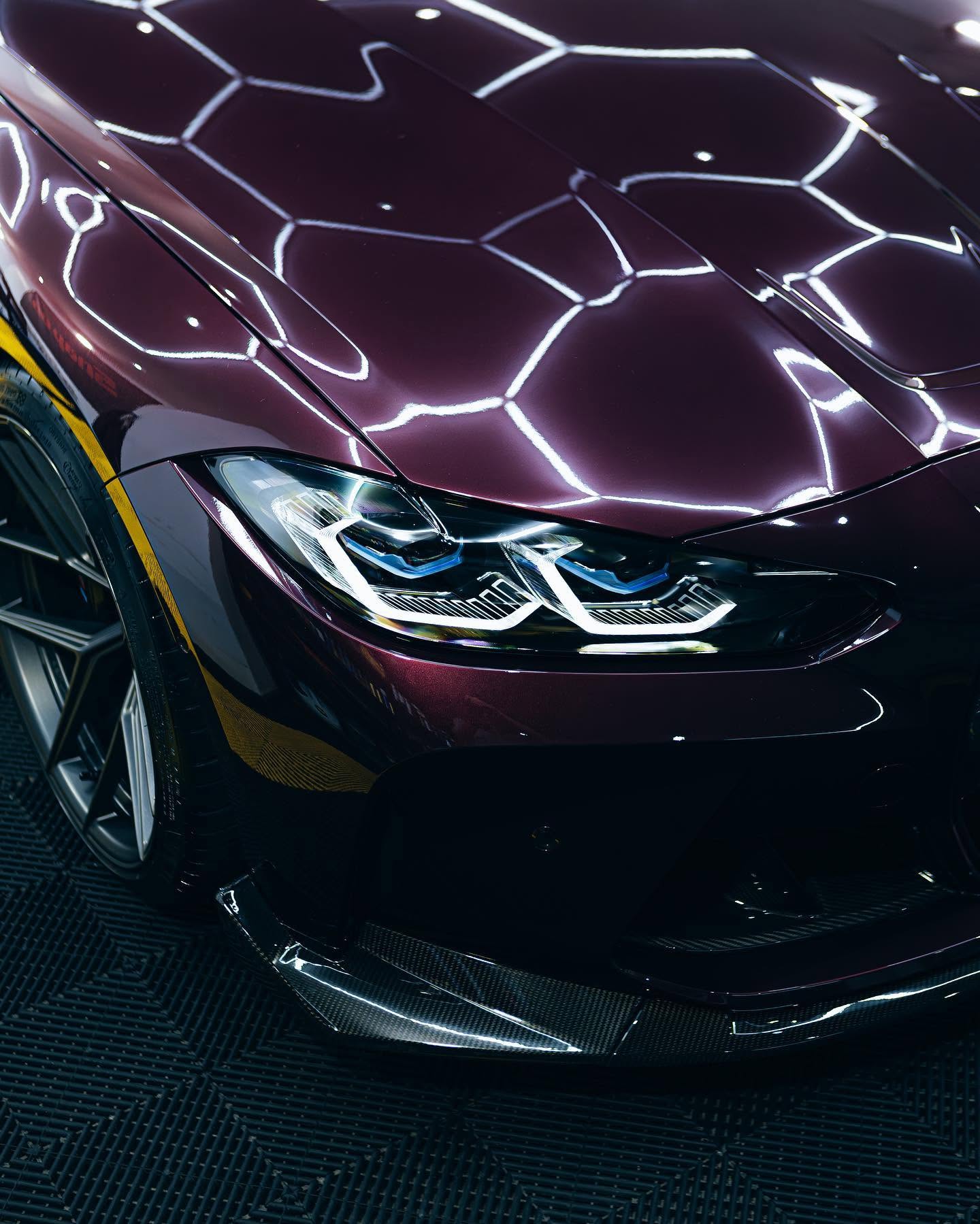 Detailed BMW M front corner with bright paint reflections