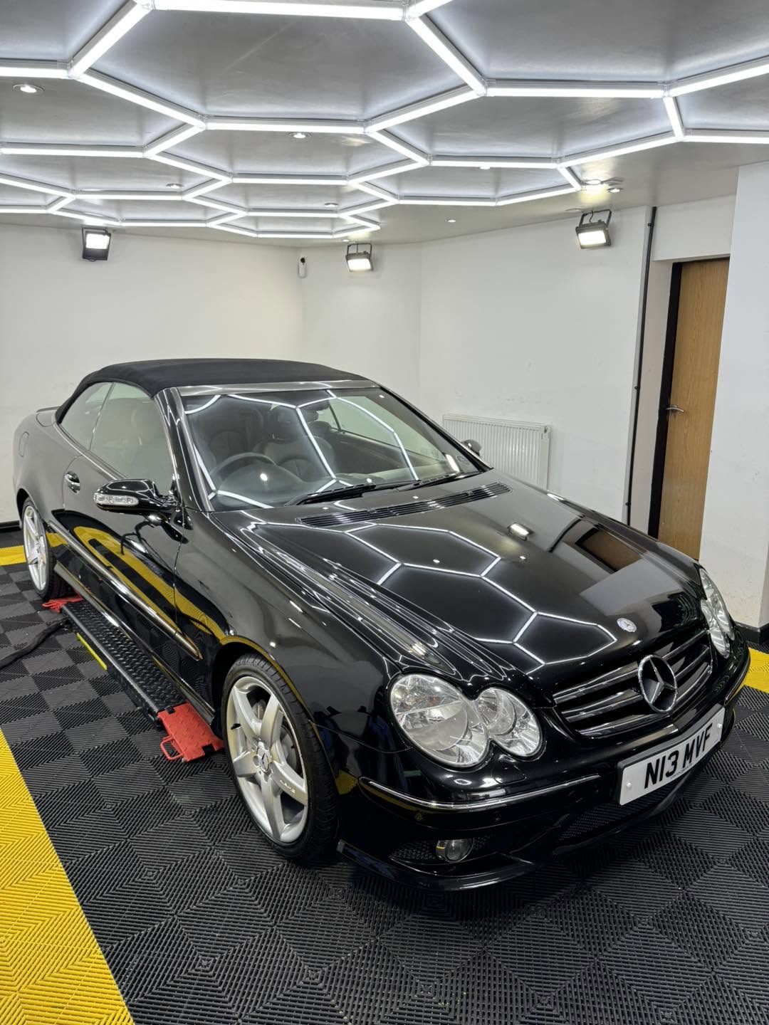 Black Mercedes-Benz convertible with a glossy finish